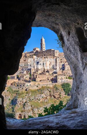 Matera view across 'la Gravina' ravine to the Sassi of Matera from inside a Sassi cave, Basilicata, Italy. A UNESCO World Heritage site. Stock Photo
