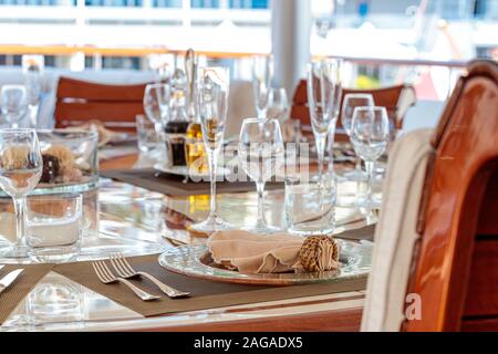 Closeup shot of the elegant laying of a dinner table on a yacht Stock Photo