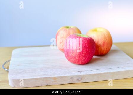 Fresh Red Apples Isolated on Cutting Board Stock Photo