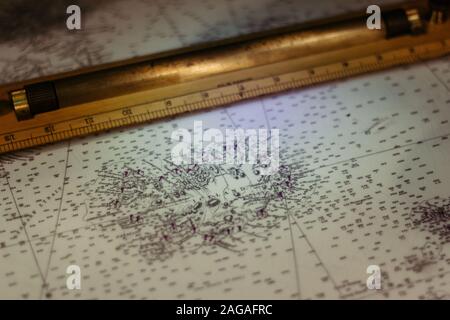 PORTSMOUTH, UNITED KINGDOM - Feb 23, 2017: A high angle closeup shot of a golden ruler on a map Stock Photo