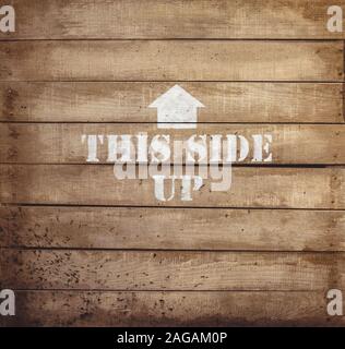Closeup shot of a wooden surface with an arrow painted on it - great for background Stock Photo