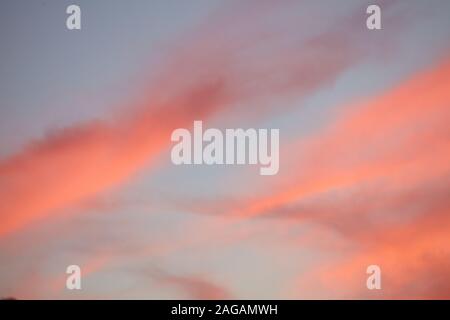 Low angle shot of the beautiful colorful sunset sky with coral clouds Stock Photo