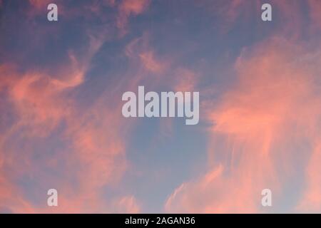 Low angle shot of the beautiful colorful sunset sky with coral clouds Stock Photo