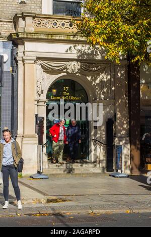 16 October 2019 A couple of elderly gentlemen at the entrance Belfast's Linen Hall Library in Donegall Square North Belfast. This famous library is a Stock Photo