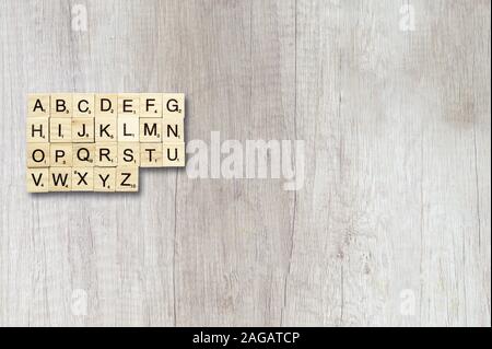 Overhead shot of board game cubes on a wooden surface Stock Photo