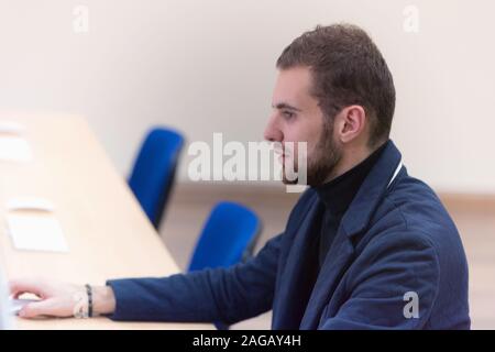 Programming. Man Working On Computer In IT Office, Sitting At Desk Writing Codes. Programmer Typing Data Code, Working On Project In Software Developm Stock Photo