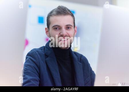 Programming. Man Working On Computer In IT Office, Sitting At Desk Writing Codes. Programmer Typing Data Code, Working On Project In Software Developm Stock Photo