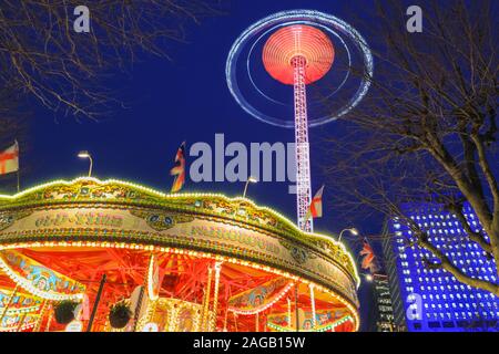 Southbank, London, 18h Dec 2019. A traditional carousel and fairground ride are busy in the nice dry weather. Clear blue skies on London's Southbank, following a dry but cold day in the capital. Credit: Imageplotter/Alamy Live News Stock Photo