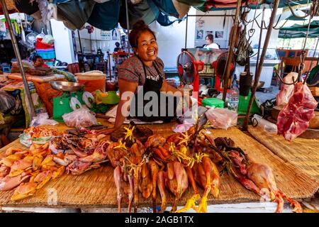 A Smiling Local Woman Sells Fresh Meat At Phsar Chas Market (Old Market) Phnom Penh, Cambodia. Stock Photo