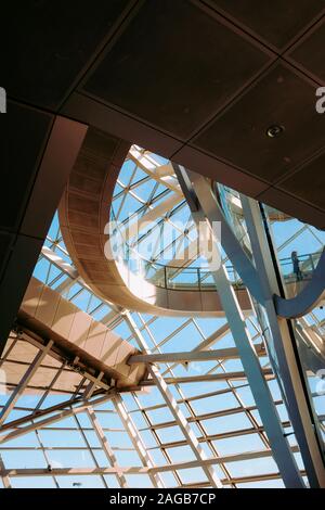 Vertical low angle shot of the interior of a metal and glass geometrical structure Stock Photo