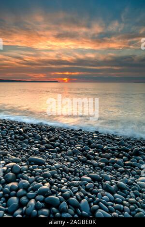 Sunset over Westward Ho! Beach, North Devon, UK Stock Photo