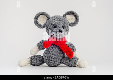 Handmade knitted mouse on a white background Stock Photo