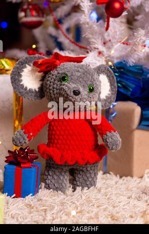 Plush toy mouse girl on New Year's background Stock Photo