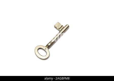 Vintage door key isolated on a white background. Stock Photo