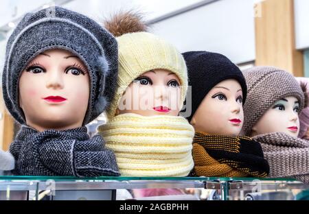 Mannequins female heads in hats and scarfs close up Stock Photo