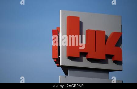 Oberndorf Am Neckar, Germany. 18th Dec, 2019. The logo of the weapons manufacturer Heckler & Koch can be seen on an advertisement in front of the company's premises. Credit: Marijan Murat/dpa/Alamy Live News Stock Photo