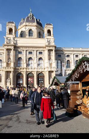 Vienna Christmas market; people shopping in daytime at the market in Maria Theresien Platz, outside the Natural History Museum, Vienna Austria Europe Stock Photo