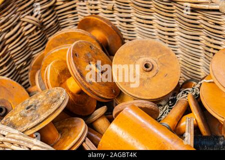 wooden cotton reels in a wicker basket close up of textile machinery in Sir Richard Arkwright's textile mill at Masson Mills Museum Derbyshire UK Stock Photo