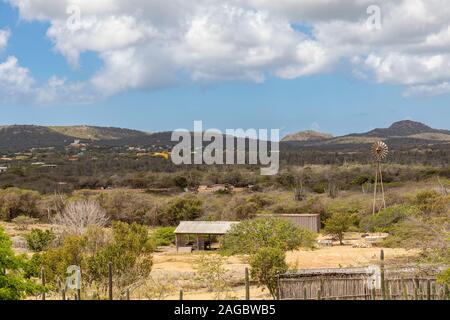 Village surrounded by green scenery under the cloudy sky in  Bonaire, Caribbean Stock Photo