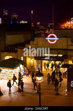 The entrance to Embankment Underground station, Villiers Street, London at night Stock Photo