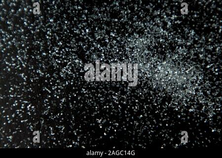 Abstract background glitter snow on black surface Stock Photo - Alamy