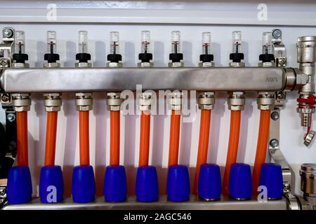 new distribution manifold and pipes for underfloor heating Stock Photo