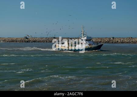 A fishing trawler returns to the Port of Aveiro Portugal Stock Photo