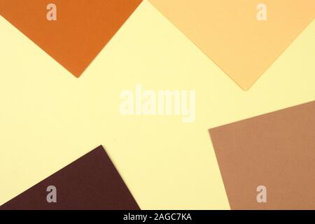 Abstract geometric paper background in earth tone. Many earth tones originate from clay earth pigments, such as umber, ochre, and sienna. Stock Photo