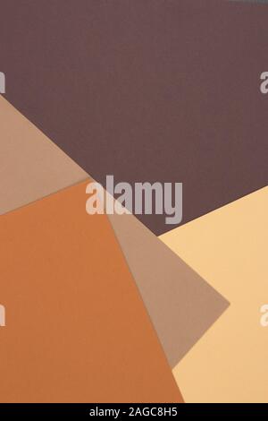 Abstract geometric paper background in earth tone. Many earth tones originate from clay earth pigments, such as umber, ochre, and sienna. Stock Photo