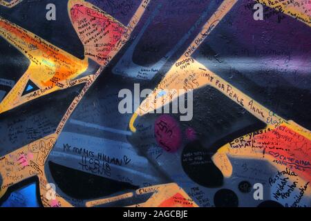 Messages and graffiti on the Peace wall, or Peace Line, running along Cupar Way in Belfast. It is one of the many separation barriers in Northern Irel Stock Photo