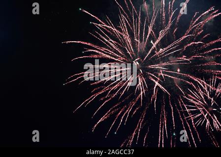 Firework lights over dark background Stock Photo