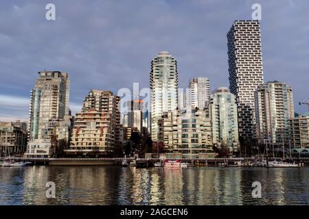 Gleaming condominium towers of Yaletown overlook False Creek at sunset in Vancouver, British Columbia Stock Photo