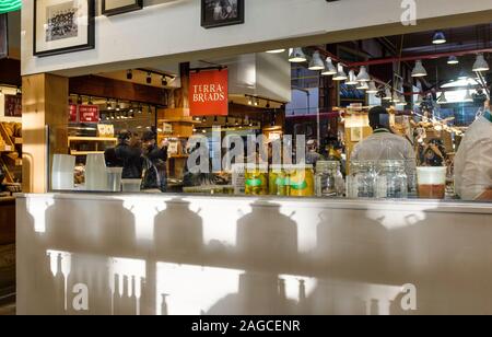 Late afternoon light filters through jars and product displays at the Granville Island Public Market in Vancouver, British Columbia Stock Photo