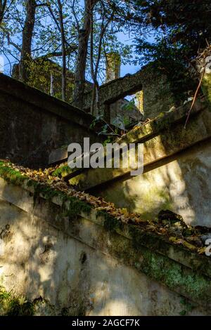 Vertical shot of an old abandoned part of a hospital on a mountain Medvednica in Zagreb, Croatia Stock Photo