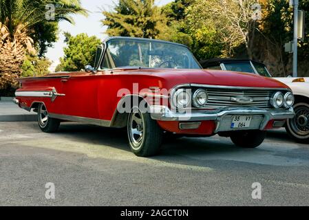 Izmir, Turkey - September 23, 2018: Front view of a red colored 1960 Chevrolet Impala. Stock Photo