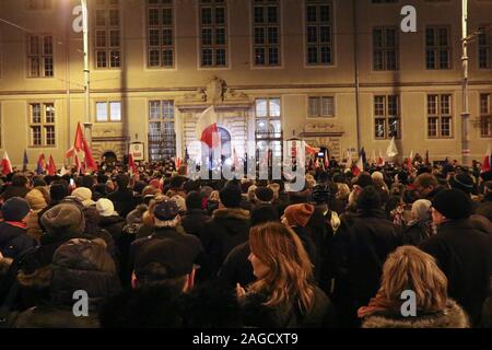 Gdansk, Poland. 18th Dec, 2019. People with Polish and EU flags protesting in front of Court are seen in Gdansk, Poland on 18 December 2019People gathered in over 180 Polish cities to protest against a proposal by the ruling Law and Justice nationalists party, that would allow for judges to be punished and even fired if they question the legitimacy of the government's judicial reforms and, if they will apply European Union laws. Credit: Vadim Pacajev/Alamy Live News Stock Photo