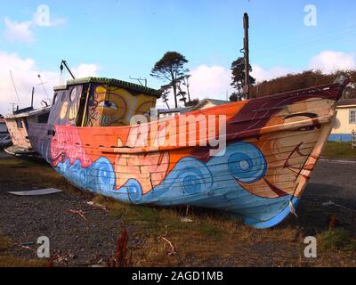 Scrapped old artisanal fishing vessels in a ship graveyard near Puerto Williams (Chile), the world' southernmost village Stock Photo