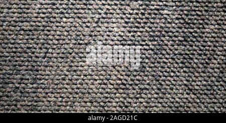 Knitted fabric. Large nodes. Abstract textured background. Stock Photo