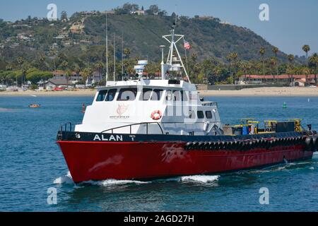 A 100 ft triple diesel screw aluminum crew boat, the 'Alan T', a Ship Services boat, cruising through the Santa Barbara harbor in Southern California, Stock Photo