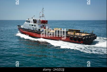 A 100 ft triple diesel screw aluminum crew boat, the 'Alan T', a So Cal Ship Services boat, leaving the Santa Barbara harbor towards the Pacific Ocean Stock Photo