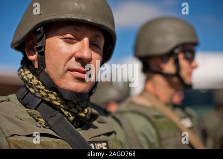 Portrait of a military policeman standing next to a colleague. Stock Photo