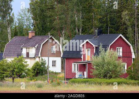 Colored wooden houses in Roslagen, Sweden Stock Photo