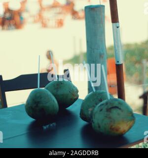 Closeup shot of coconuts on a table with a blurred background  in Brazil Stock Photo