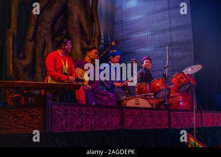 HANOI, VIETNAM - Oct 22, 2019: A group of musicians performing national songs on the stage in Hano, Vietnam Stock Photo