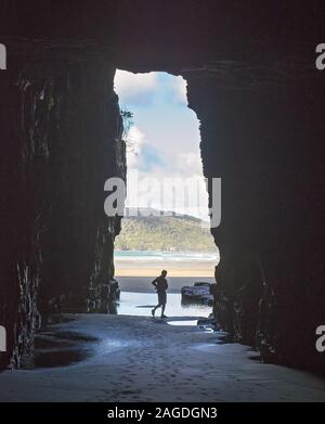 CATLINS COAST, SOUTHLAND, NEW ZEALAND - Dec 17, 2013: The Entrance to cathedral caves in the catlins area, Southland, New zealand. People are seen nea Stock Photo