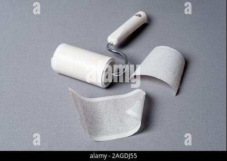 adhesive lint roller, the device used to remove small dust or fibers on the material (such as clothing) Stock Photo