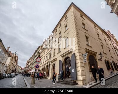 PRAGUE, CZECHIA - NOVEMBER 2, 2019: Nerudova street, a pedestrian cobblestone alley of Hradcany hill, on the Prague Castle, surrounded by tourists and Stock Photo