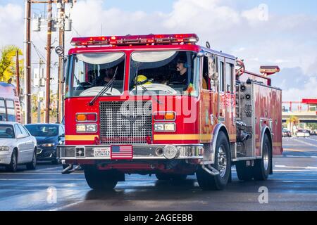 Dec 8, 2019 Los Angeles / CA / USA - Los Angeles county fire department engine driving on a street; Stock Photo