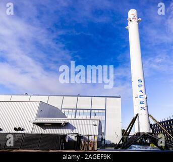 Dec 8, 2019 Hawthorne / Los Angeles / CA / USA - SpaceX (Space Exploration Technologies Corp.) headquarters; Falcon 9 rocket displayed in the front; S Stock Photo