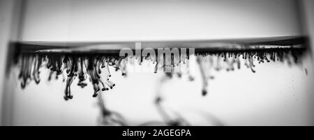 Greyscale shot of beautiful patterns formed from the black smoke Stock Photo